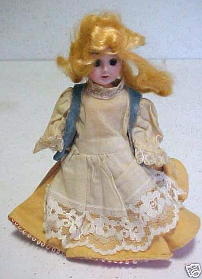 Vintage Sleepy Eye Hard Plastic Doll in Yellow Costume w/Apron