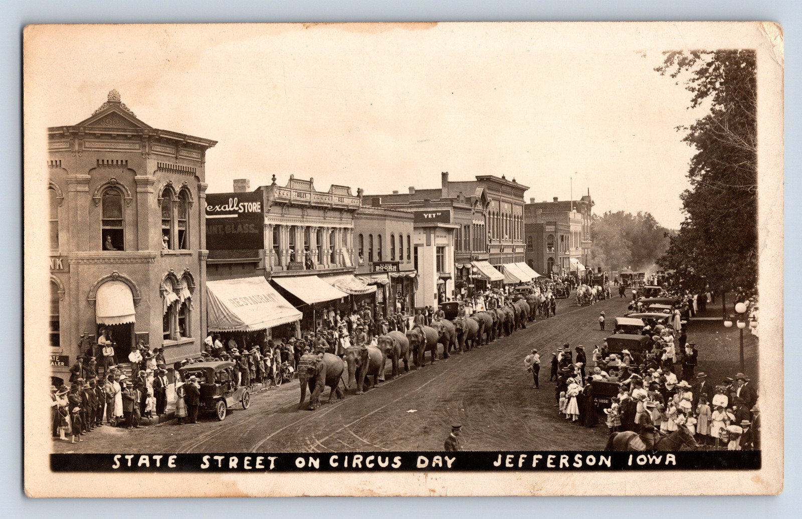 Vintage RPPC Jefferson IA Iowa Circus Parade Elephants Busy Crowd Businesses U1
