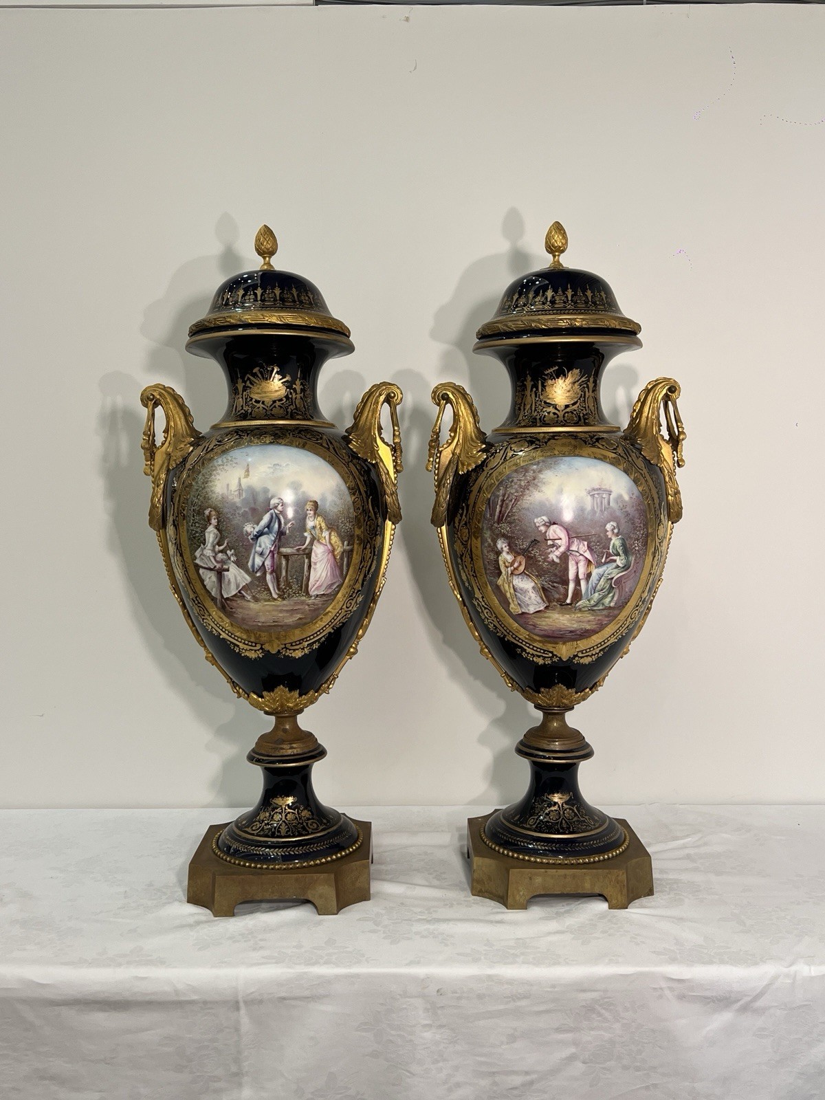 A Pair of Large French Sevres Style Hand Painted Vases and Lids 19th Century Era A Pair of Large French Sevres Style Hand Painted Vases and Lids 19th Century Era