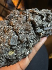 This authentic meteorite boasts a rugged exterior with coarse edges that's heavy picture
