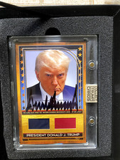 Autographed Donald Trump Card with Authentic Piece Of Suit & Tie From Mugshot picture